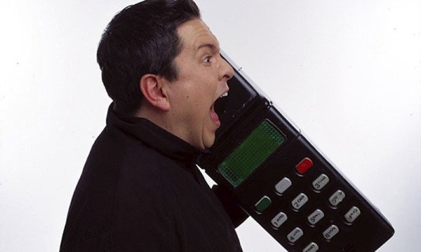 Loud and irritating: Dom Joly in Trigger Happy mocking mobile phone users.